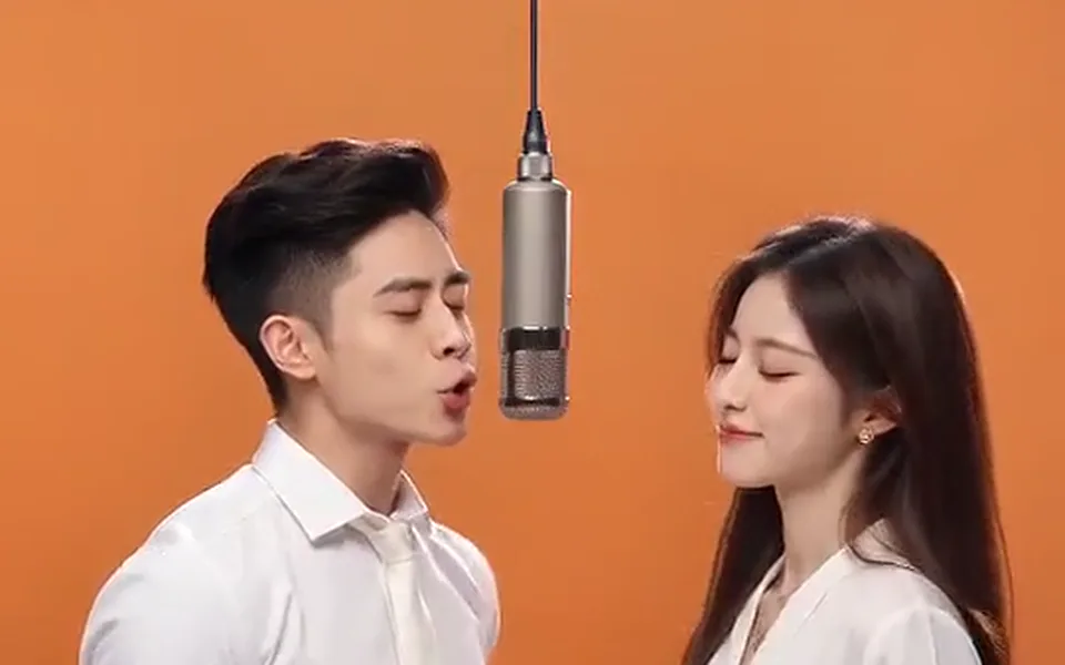 Frame from our demo: a young couple in the orange booth.